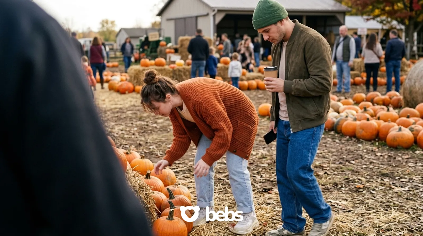 Young couple picking pumpkins at a fall pumpkin patch, a classic cuffing season date idea